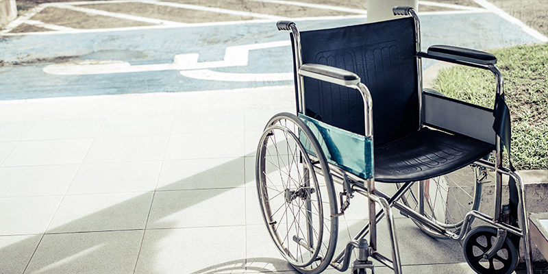 wheelchair-infront-of-disabled-parking-bay