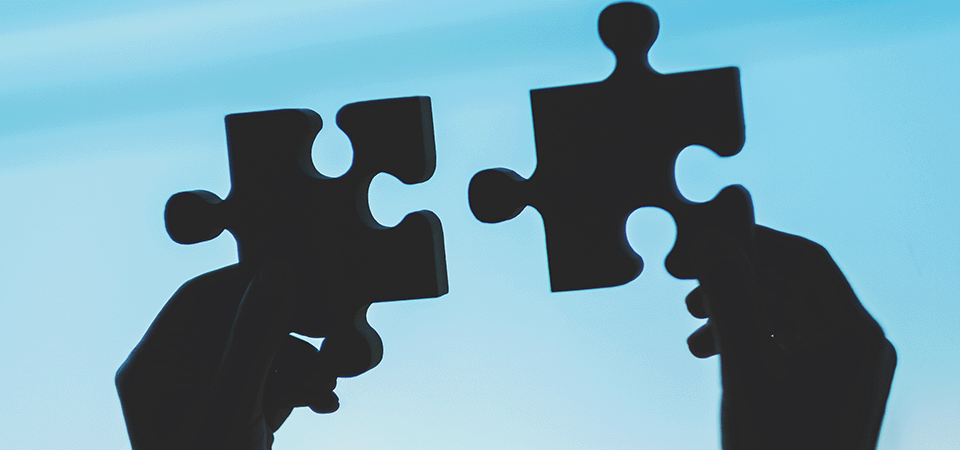 two-jigsaw-pieces-held-up-representing-pension-sharing-order-costs-splitting-pensions-FEATURED-IMAGE