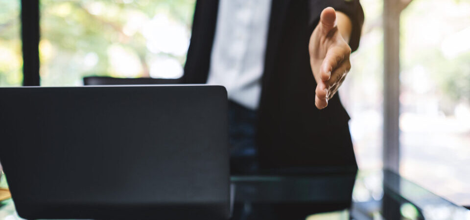 employer-offering-handshake-what-is-a-reasonable-settlement-agreement-blog-FEATURED-IMAGE