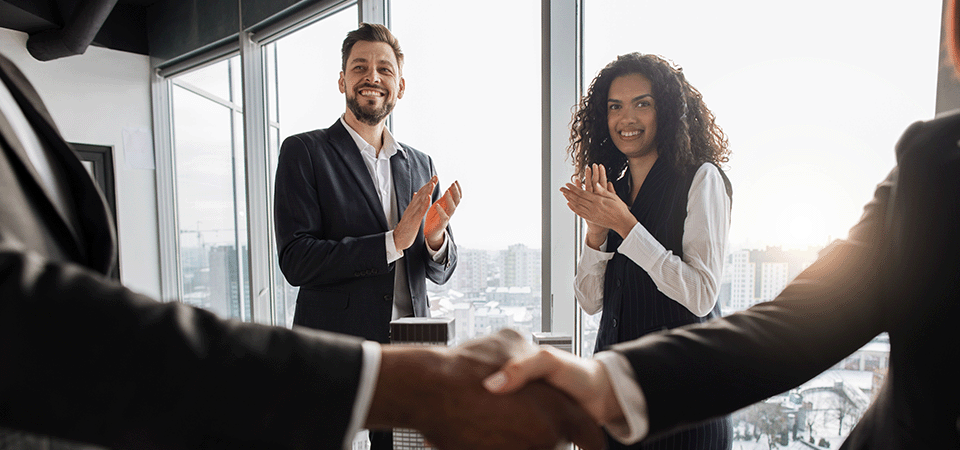 how-to-sell-a-business-deal-handshake-office-FEATURED-IMAGE