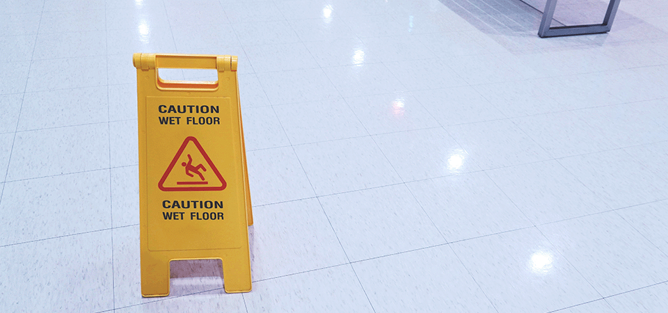 wet-floor-sign-on-ground-slip-and-trip-claims-at-work-FEATURED-IMAGE